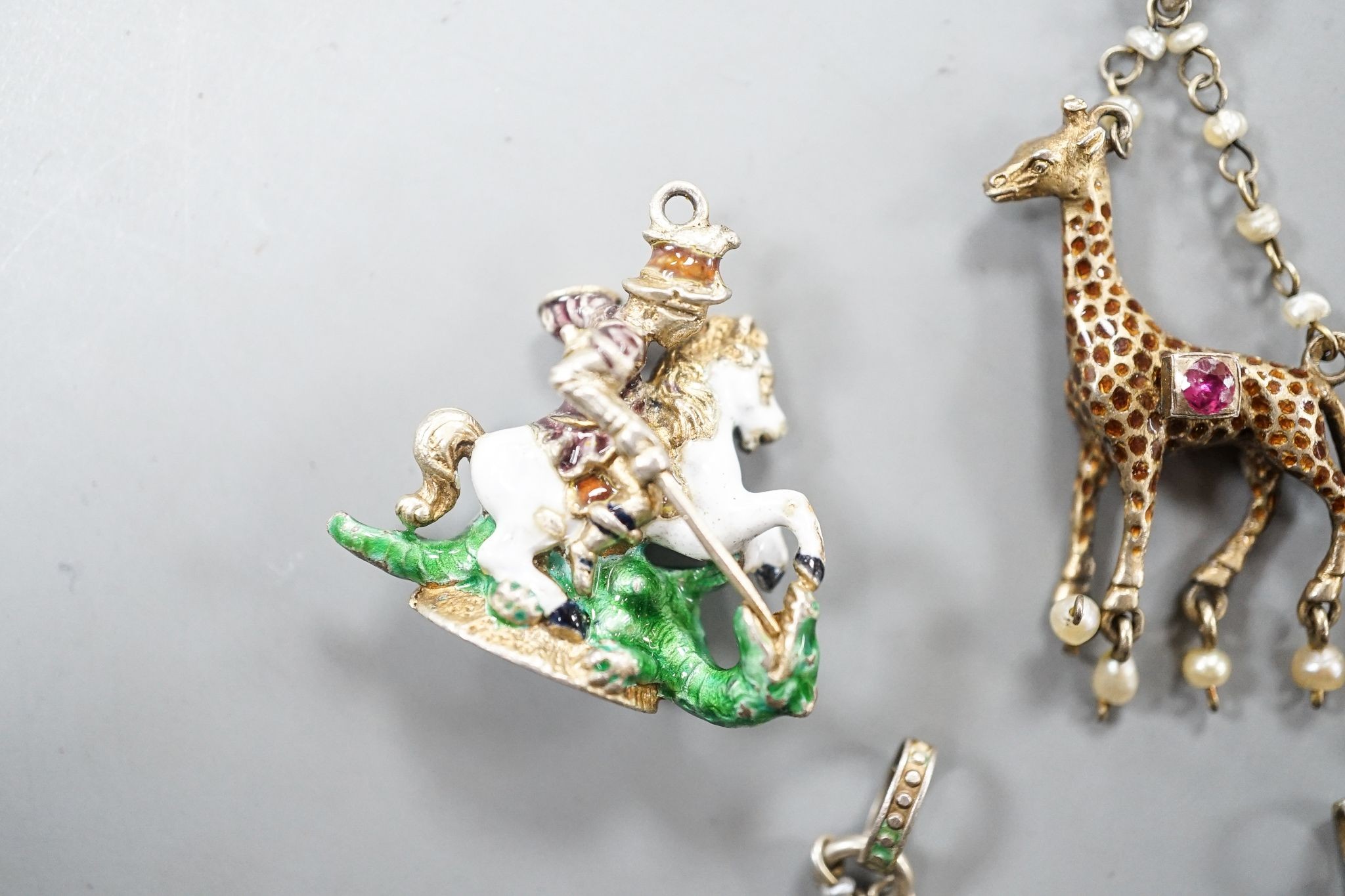 Five assorted Austro-Hungarian style gilt white metal and enamel pendants/fob seal etc. including mermaid, giraffe and elephant, giraffe 32mm.